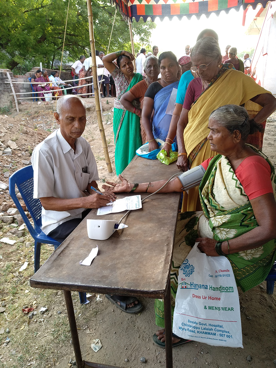 A volunteer taking a blood pressure test before a doctor's consultation at a CPI(M)-run camp in Wyra, Khammam District, Telangana.